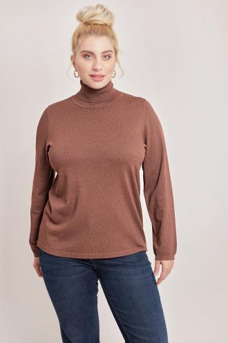 Πλεκτή μπλούζα από μιξ βισκόζης με lurex. Γιακάς ζιβάγκο και μακριά μανίκια. Ριπ λεπτομέρεια στην λαιμόκοψη και την μανσέτα. Το μοντέλο έχει ύψος 177εκ, στήθος 110, μέση 85, περιφέρεια 115 και φοράει μέγεθος S